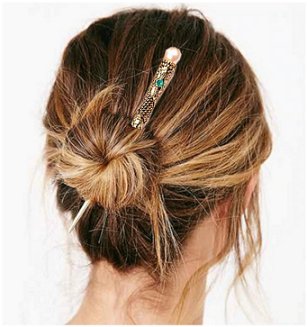 Dreadz Hair Stick with Blue Jewel Detail shown holding hair in twisted bun