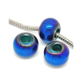 Three Dreadz blue-dyed glass round dreadlock hair beads with a six point 8 millimetre hole through the middle, with one of the beads threaded with a silver spiral chain, shown against a white background