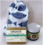 Mane Tamer Dreadlock Wax and Dreadz Tea Tree Dread Shampoo Bar DUO Pack Combo Kit (Style 4) shown against blue fish printed drawstring bag