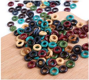 Picture of dozens of Wooden Earth Tones Hoop 6mm Hole Dreadlock Hair Beads displayed on wooden surface