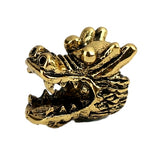 A single gold-coloured dragon head design dreadlock hair bead with a 5 millimetre hole approx in the middle.