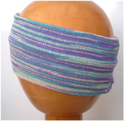 A Dreadz Fair Trade Multi-Coloured Striped Headband in Blue, Purple and White colours on a wooden mannequin head