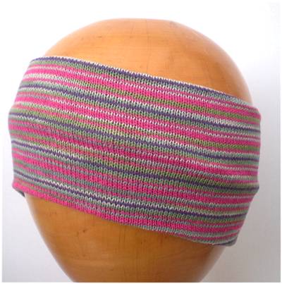 A Dreadz Fair Trade Multi-Coloured Striped Headband in Green, Pink and Purple colours on a wooden mannequin head