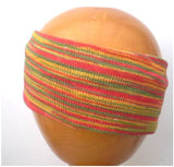 A Dreadz Fair Trade Multi-Coloured Striped Headband in Green, Yellow and Orange colours on a wooden mannequin head
