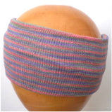 A Dreadz Fair Trade Multi-Coloured Striped Headband in Purple, Pink and Green colours on a wooden mannequin head