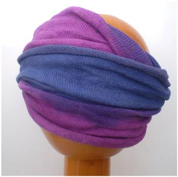 A Fair Trade Tie Dye Stretch Cotton Headwrap Dreadwrap in Blue and Purple colours shown on wooden mannequin head