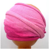 A Fair Trade Tie Dye Stretch Cotton Dreadlock Headwrap/Dreadwrap in Pink colours shown on wooden mannequin head
