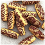 A collection of brown acrylic tribal hair beads for dreadlocks, with 6mm hole, shown grouped together on a white background