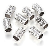 Multiple Dreadz Silver Scroll Pattern Dreadlock Hair Beads with 6.5 millimetre inner hole, sold as single beads, shown against a white background