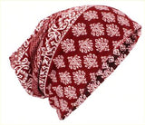 A Red and White, Ethnic, 3 in 1 Multi Function Dreadlock Beanie Hat, Headwrap Neckwarmer, displayed against a white background
