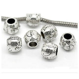 Seven Dreadz, Silver, Dreams Do Come True, Dreadlock Hair Beads with 5 millimetre hole through the middle, with one bead threaded with a silver spiral chain, shown against a white background