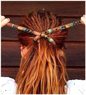 view of bendable hair tie partially wrapped around dreads into a ponytail shown from behind the head