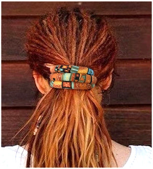 view of bendable hair tie fully wrapped around dreads into a ponytail shown from behind the head