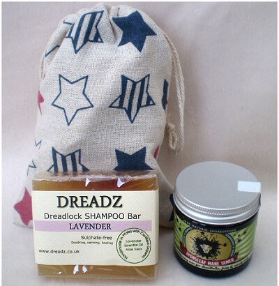 Mane Tamer Dreadlock Wax and Dreadz Lavender Shampoo Bar DUO Pack Combo Kit (Style 2) shown against star printed drawstring bag