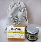 Mane Tamer Dreadlock Wax and Dreadz Lemongrass Dread Shampoo Bar DUO Pack Combo Kit (Style 3) shown against a sprig leaf printed drawstring bag