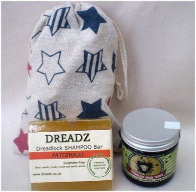 Mane Tamer Dreadlock Wax and Dreadz Patchouli Dread Shampoo Bar DUO Pack Combo Kit (Style 2) shown against star printed drawstring bag