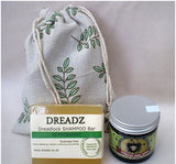 Mane Tamer Dreadlock Wax and Dreadz Peppermint Dread Shampoo Bar DUO Pack Combo Kit (Style 3) shown against a sprig leaf printed drawstring bag