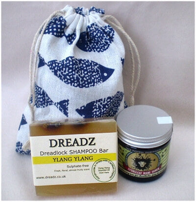 Mane Tamer Dreadlock Wax and Dreadz Ylang Ylang Dread Shampoo Bar DUO Pack Combo Kit (Style 4) shown against blue fish printed drawstring bag